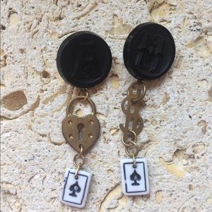 Pierced earrings made with buttons, charms